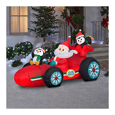 Gemmy Christmas Inflatable Santa in Racecar with Penguins